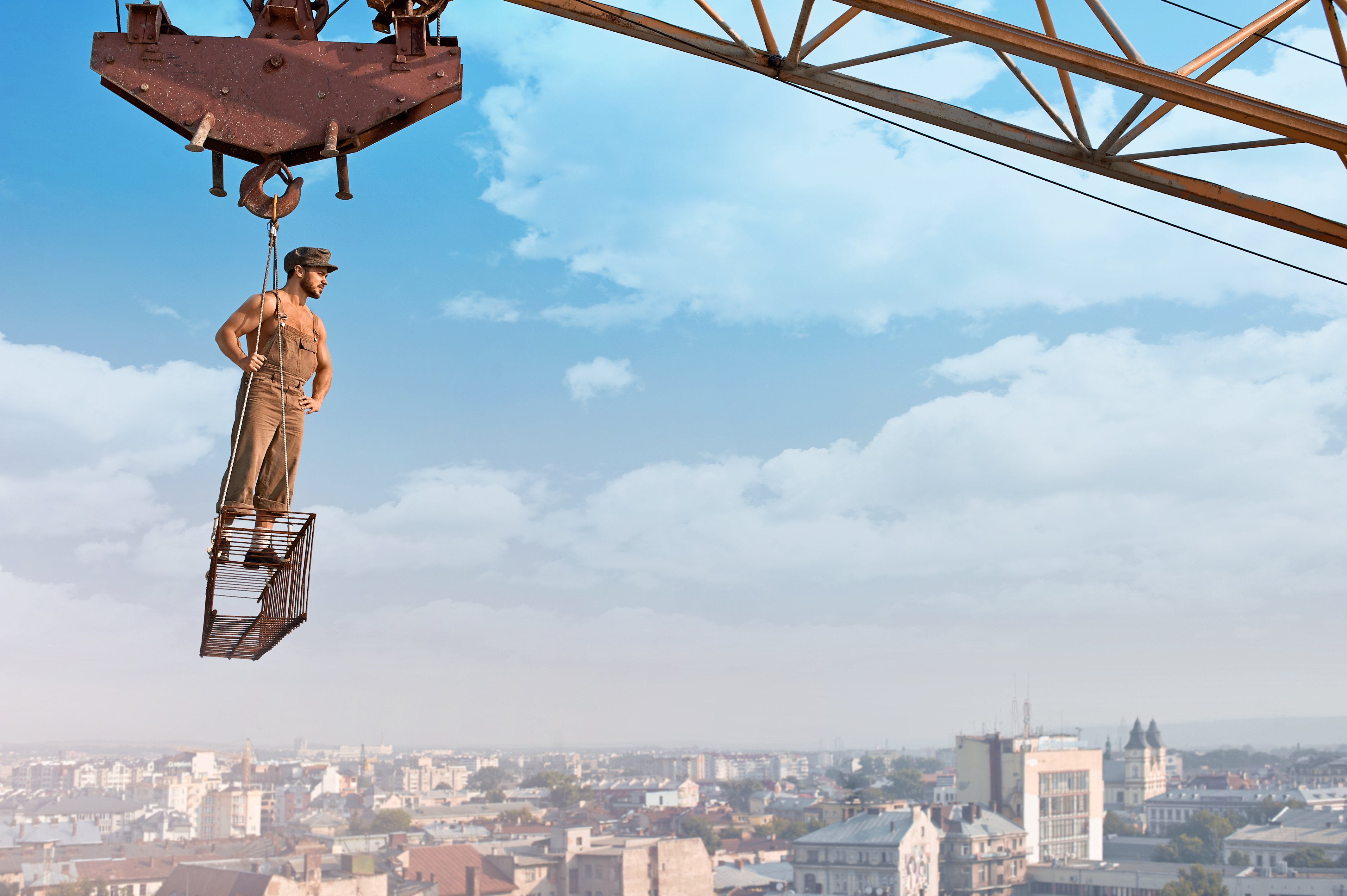 ready-day-low-angle-portrait-young-muscular-retro-builder-posing-crossbar-hanging-from-crane-skyscraper